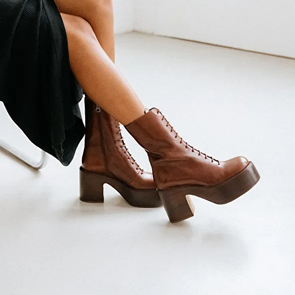 Platform boots with laces in black aged leather